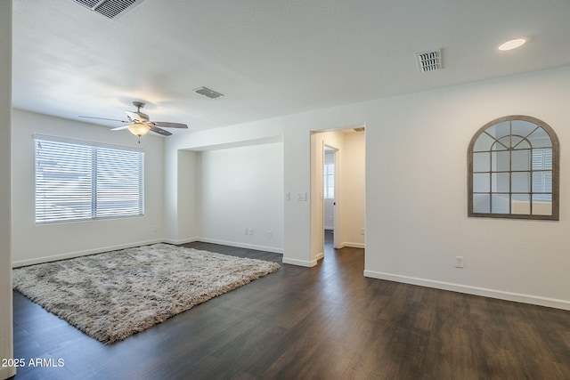 10925 E Toluca Ave, Mesa, AZ 85212 - unfurnished room featuring dark wood-style flooring, healthy amount of natural light, baseboards, a ceiling fan, and recessed lighting