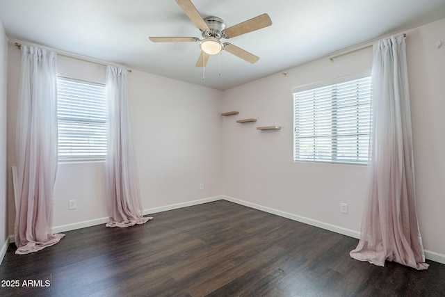 10925 E Toluca Ave, Mesa, AZ 85212 - spare room with dark wood-type flooring, ceiling fan, and baseboards