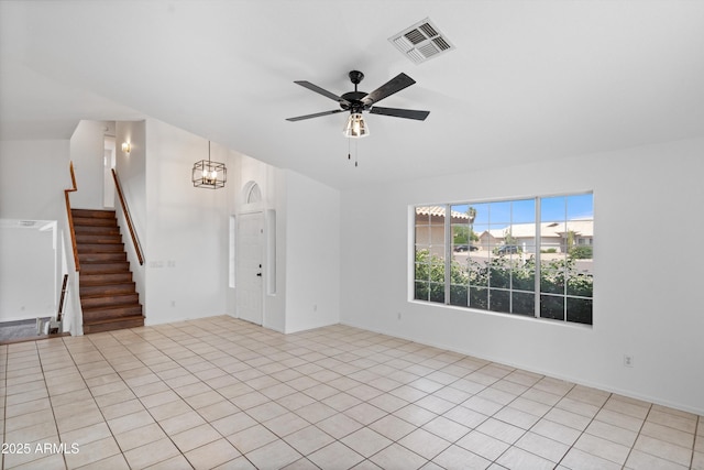 1203 W Escuda Rd, Phoenix, AZ 85027 - empty room featuring a ceiling fan, stairway, and a chandelier