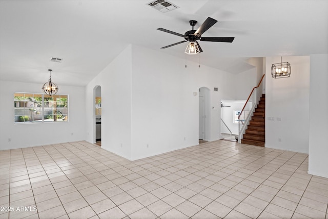 1203 W Escuda Rd, Phoenix, AZ 85027 - unfurnished living room with arched walkways, a chandelier, stairs, light tile patterned floors, and ceiling fan