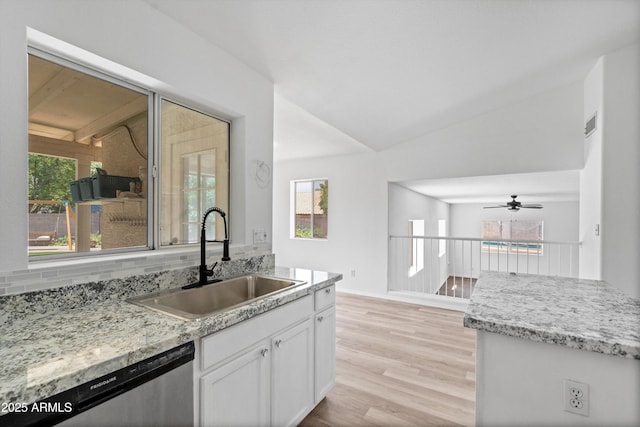 1203 W Escuda Rd, Phoenix, AZ 85027 - kitchen with stainless steel dishwasher, white cabinets, vaulted ceiling, light wood-style floors, and ceiling fan