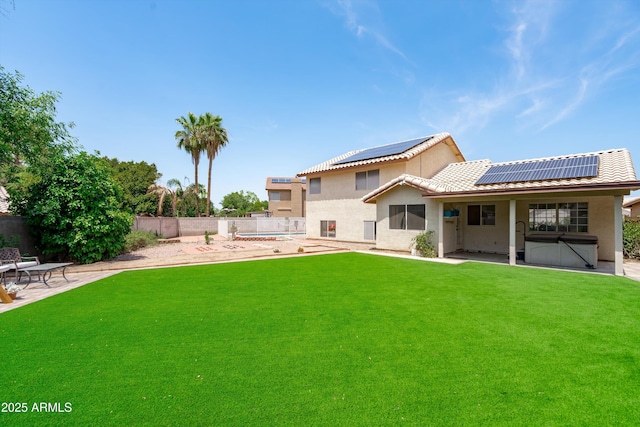 1203 W Escuda Rd, Phoenix, AZ 85027 - rear view of property with a patio area, roof mounted solar panels, a fenced backyard, stucco siding, and a tiled roof