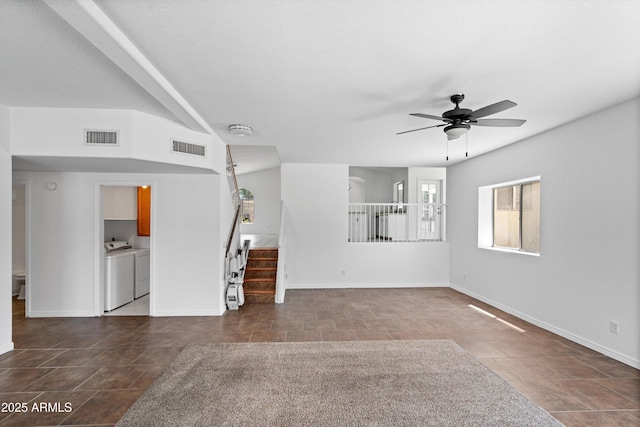 1203 W Escuda Rd, Phoenix, AZ 85027 - unfurnished living room featuring washer and dryer, stairway, a ceiling fan, and tile patterned floors