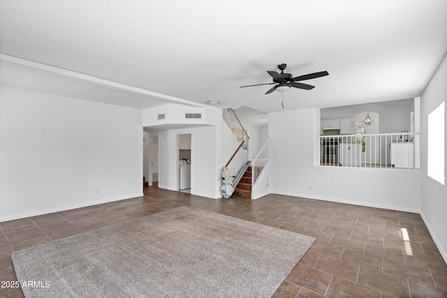 1203 W Escuda Rd, Phoenix, AZ 85027 - unfurnished living room with stairs, ceiling fan, and dark tile patterned flooring