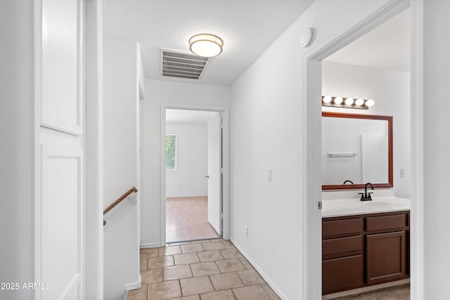 1203 W Escuda Rd, Phoenix, AZ 85027 - hall featuring an upstairs landing and a sink