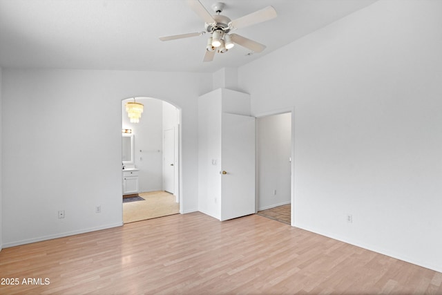 1203 W Escuda Rd, Phoenix, AZ 85027 - spare room featuring a ceiling fan, arched walkways, light wood-type flooring, and lofted ceiling