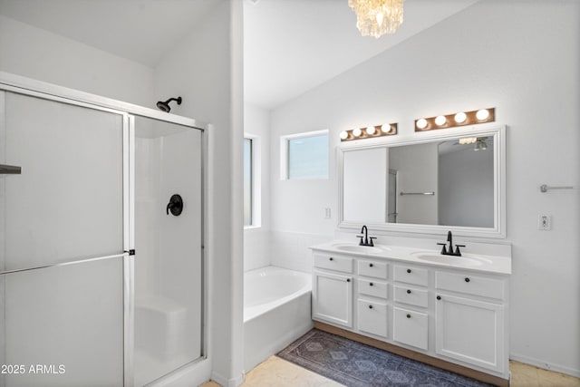 1203 W Escuda Rd, Phoenix, AZ 85027 - bathroom with a shower stall, double vanity, a bath, lofted ceiling, and tile patterned floors