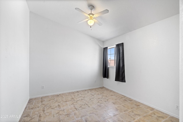 1203 W Escuda Rd, Phoenix, AZ 85027 - unfurnished room featuring a ceiling fan, stone finish floors, and vaulted ceiling