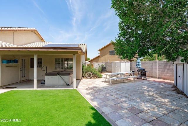 1203 W Escuda Rd, Phoenix, AZ 85027 - fenced backyard featuring a hot tub, a patio, a storage unit, and area for grilling