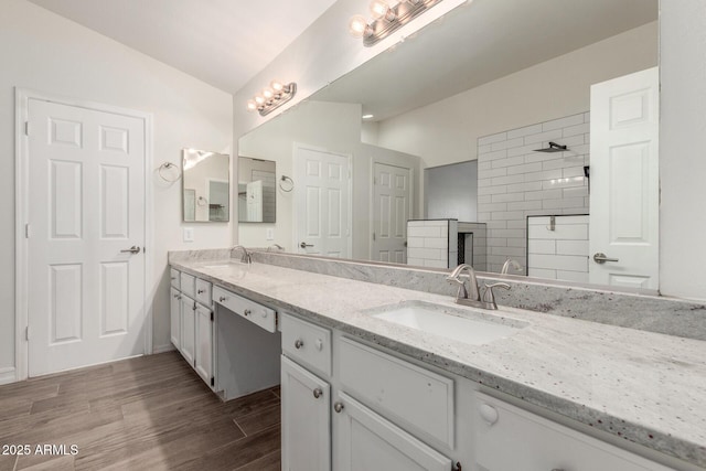 3805 E Desert Flower Ln, Phoenix, AZ 85044 - full bath with double vanity, wood finished floors, and a walk in shower