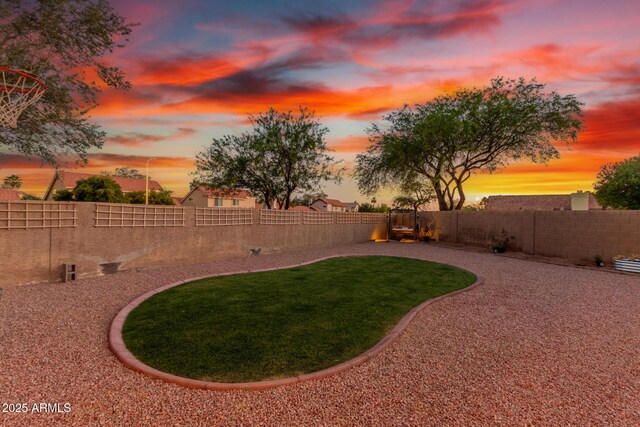 3805 E Desert Flower Ln, Phoenix, AZ 85044 - view of yard at dusk