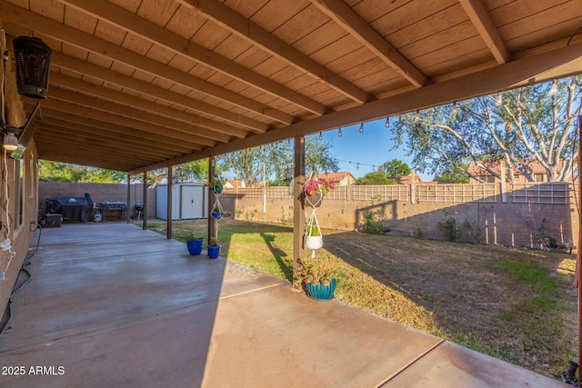 3805 E Desert Flower Ln, Phoenix, AZ 85044 - view of patio with a storage shed, an outbuilding, and grilling area