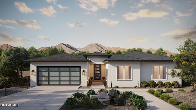 prairie-style house with a mountain view and a garage