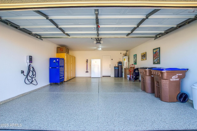 garage with water heater and white refrigerator