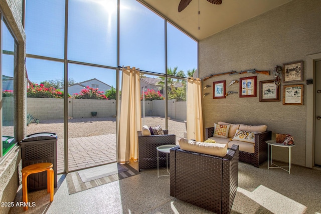 sunroom featuring ceiling fan