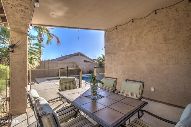 view of patio / terrace featuring a fenced in pool