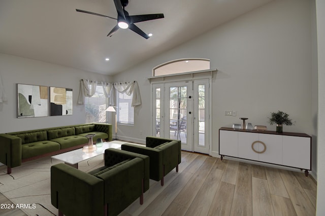 living room featuring light wood-type flooring, ceiling fan, and lofted ceiling