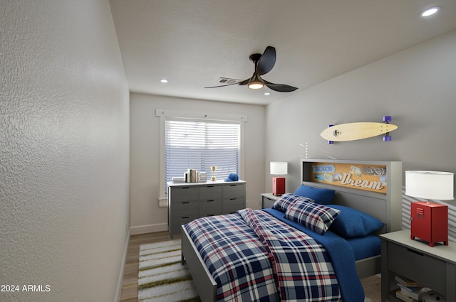 bedroom featuring hardwood / wood-style flooring and ceiling fan