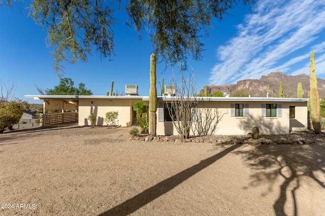 view of front of house with a mountain view and a carport