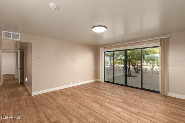 unfurnished room featuring light wood-type flooring