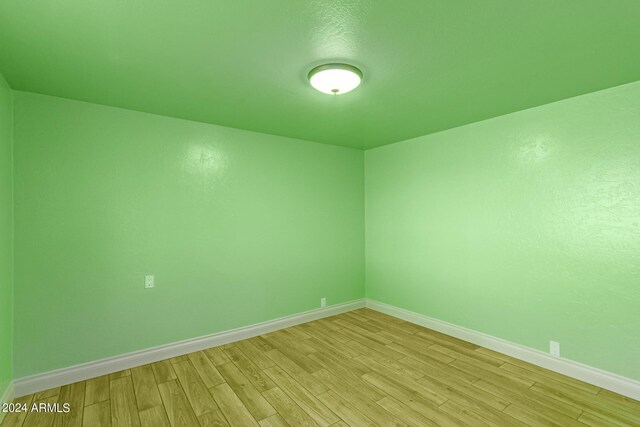 unfurnished room with light hardwood / wood-style flooring