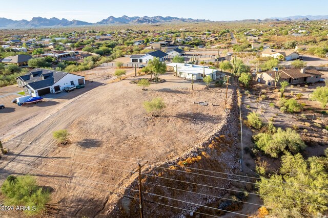 birds eye view of property featuring a mountain view