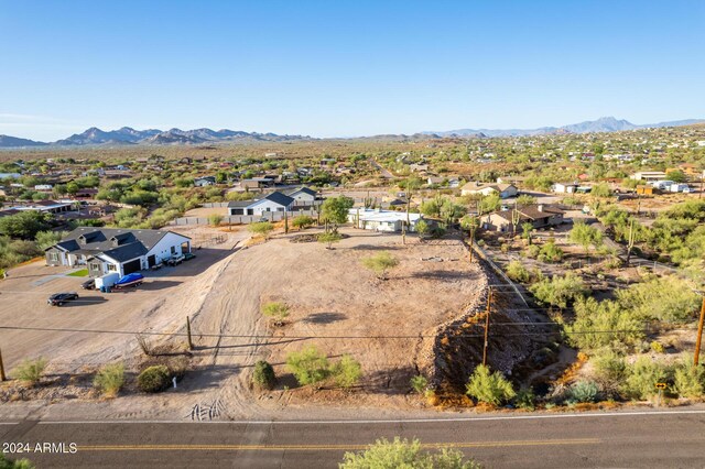 birds eye view of property featuring a mountain view