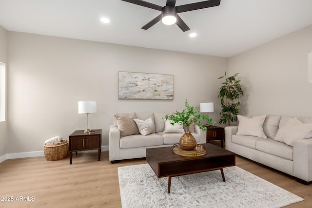 living room featuring recessed lighting, baseboards, light wood-type flooring, and a ceiling fan