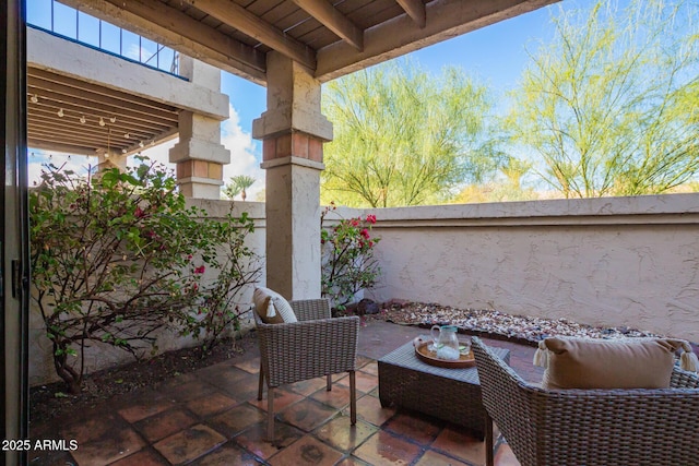 view of patio / terrace featuring fence