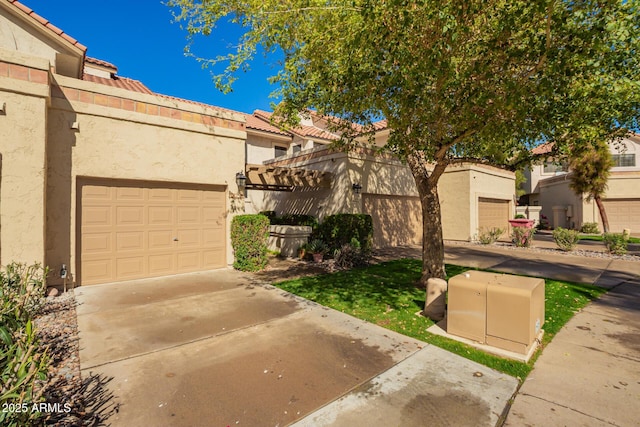 mediterranean / spanish home with stucco siding, a garage, driveway, and a tiled roof