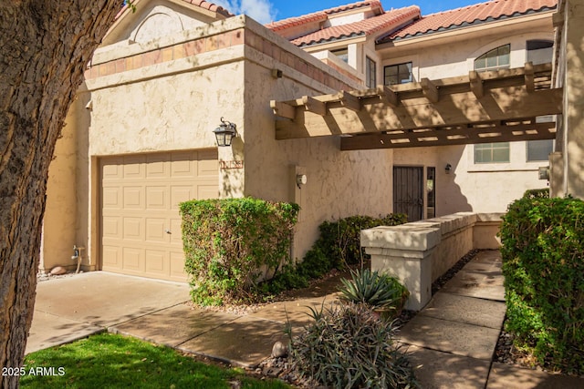 exterior space featuring driveway and an attached garage