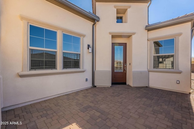 entrance to property featuring a patio area