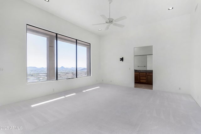 carpeted empty room with recessed lighting and ceiling fan