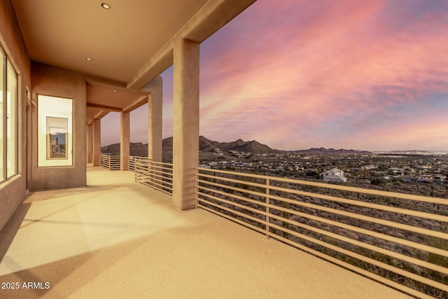 balcony at dusk with a mountain view