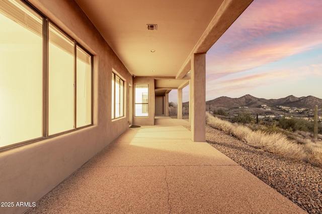 view of patio with visible vents and a mountain view