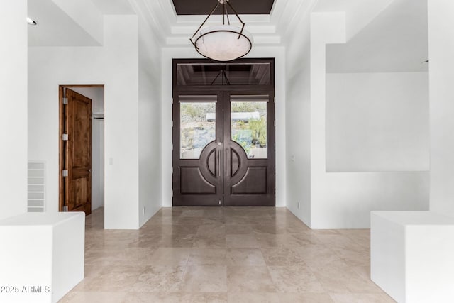 foyer with french doors and visible vents