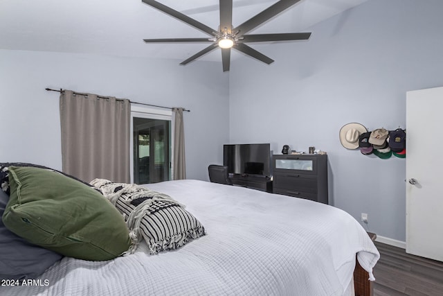 bedroom with dark hardwood / wood-style flooring, ceiling fan, and lofted ceiling