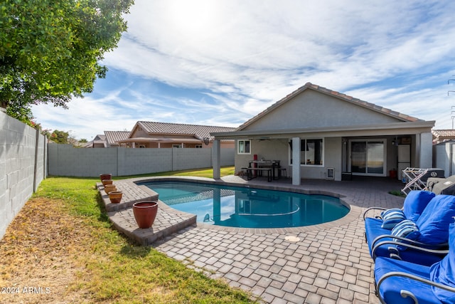 view of pool featuring a patio