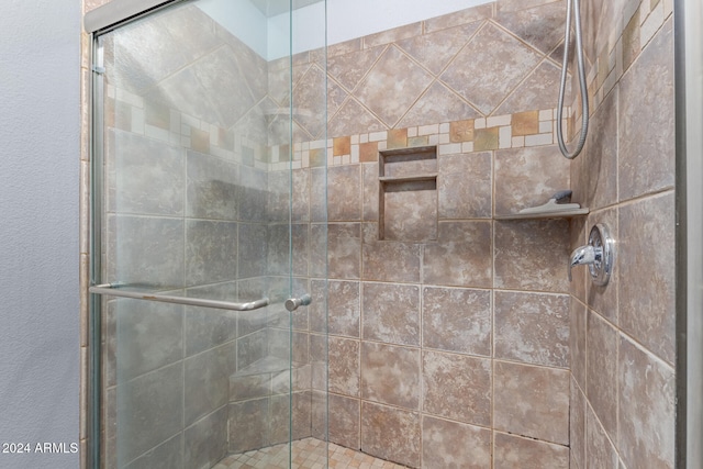 bathroom featuring an enclosed shower