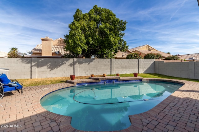 view of swimming pool featuring a patio