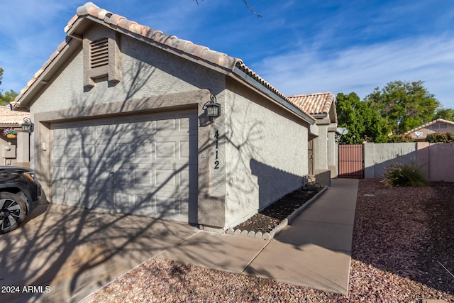 view of side of property with a garage