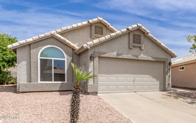 view of front of home with a garage