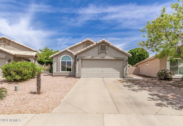 ranch-style house featuring a garage