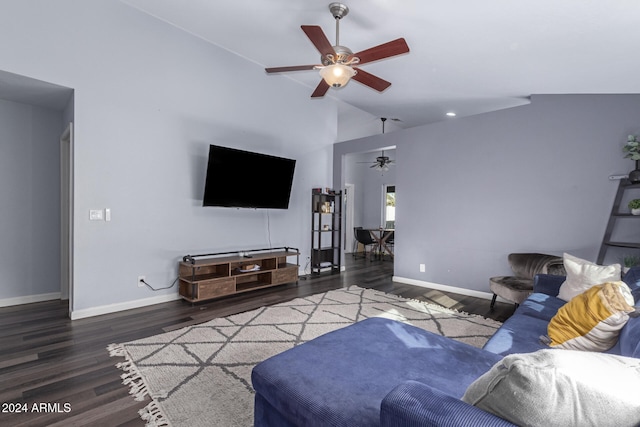 living room featuring ceiling fan, dark wood-type flooring, and vaulted ceiling