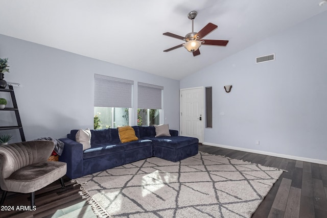 living room featuring dark hardwood / wood-style floors, high vaulted ceiling, and ceiling fan