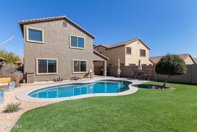 view of pool featuring a lawn, a patio area, a fenced backyard, and a fenced in pool