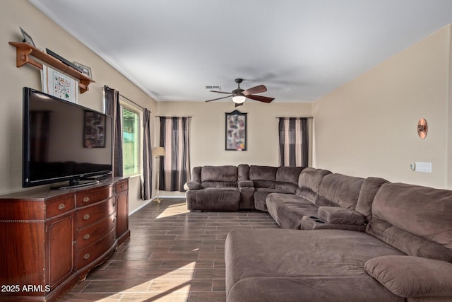 living room with visible vents, a ceiling fan, and wood finish floors