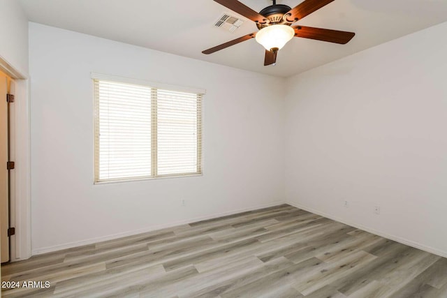 empty room featuring ceiling fan and light wood-type flooring