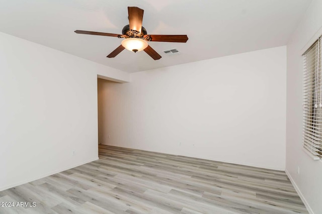 spare room with ceiling fan and light hardwood / wood-style floors