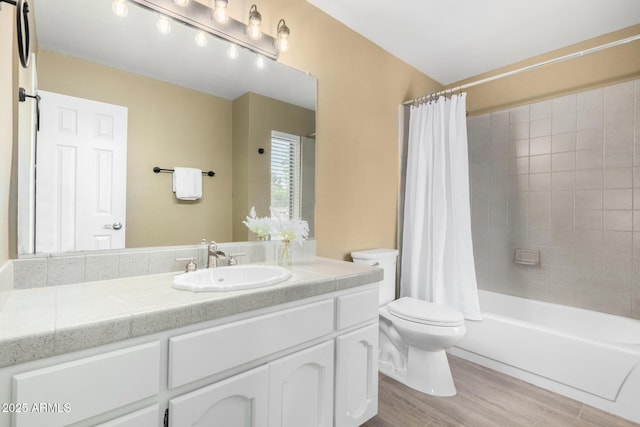 bathroom featuring shower / tub combo with curtain, vanity, toilet, and wood finished floors